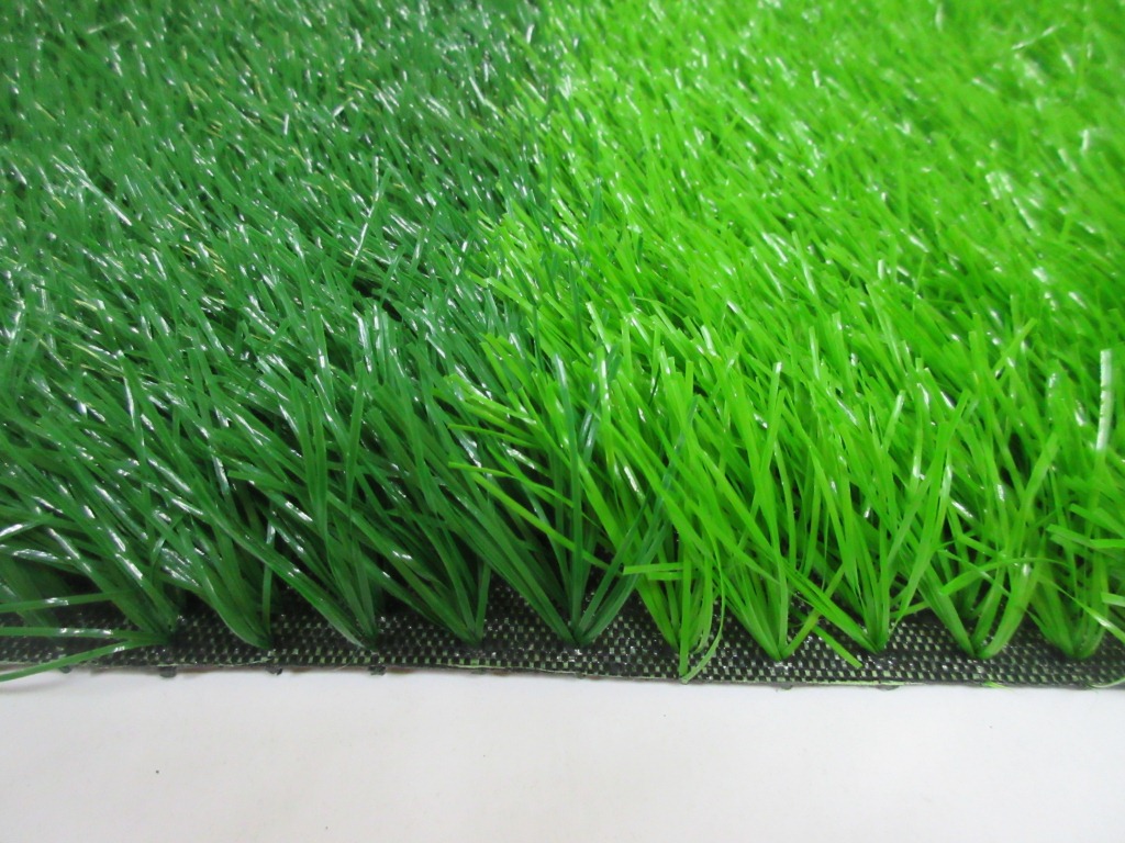 青岛绿草地人造草坪有限公司专业生产人造草坪球场、假的绿草皮